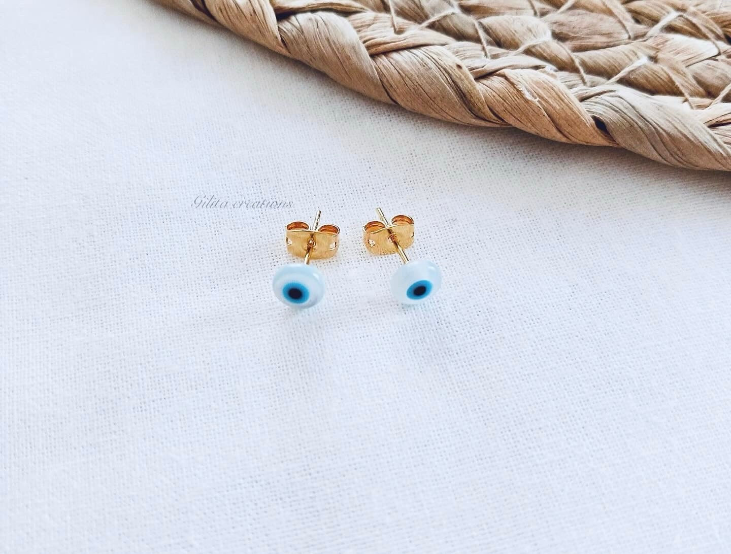 Σκουλαρίκια καρφωτά με μάτι φίλντισι